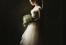 woman in wedding dress, dark background