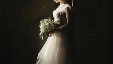 woman in wedding dress, dark background