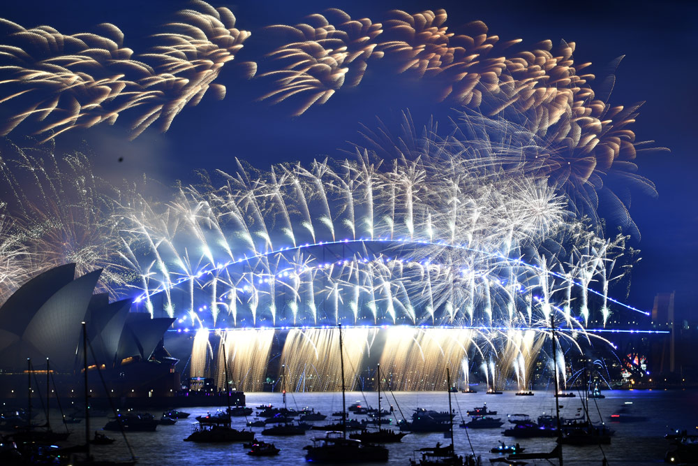 Los países realizan celebraciones discretas en 2022 debido a la pandemia 3 Sydney, Australia, 1 de enero de 2022: Exhibición de fuegos artificiales de medianoche sobre la Ópera de Sydney y el puente del puerto de Sydney durante las celebraciones de año Nuevo. Foto: Dean Lewins/AAP/dpa.