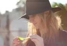Attractive woman in hat with hydroponics