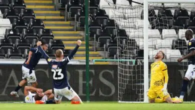 An own goal by Swansea City's Nathan Wood hands Millwall a 2-2 draw in the Championship.